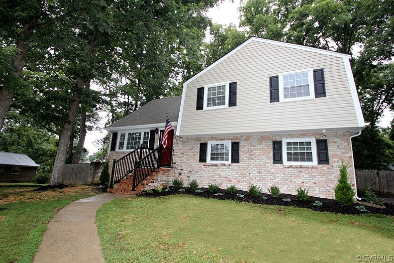 12010 West Petty Road Midlothian, VA 23113 - Photo 20 of 20 a front view of a house with a garden