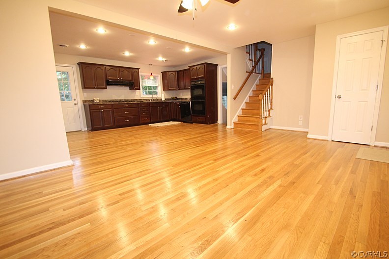 12010 West Petty Road Midlothian, VA 23113 - Photo 3 of 20 a view of kitchen and empty room with wooden floor