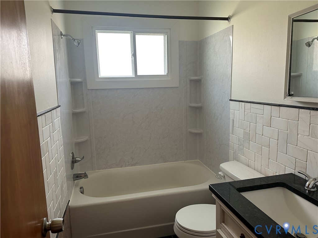 205 Airport Road Mattaponi, VA 23110 - Photo 11 of 15 Full bath with tile walls, vanity, washtub / showe