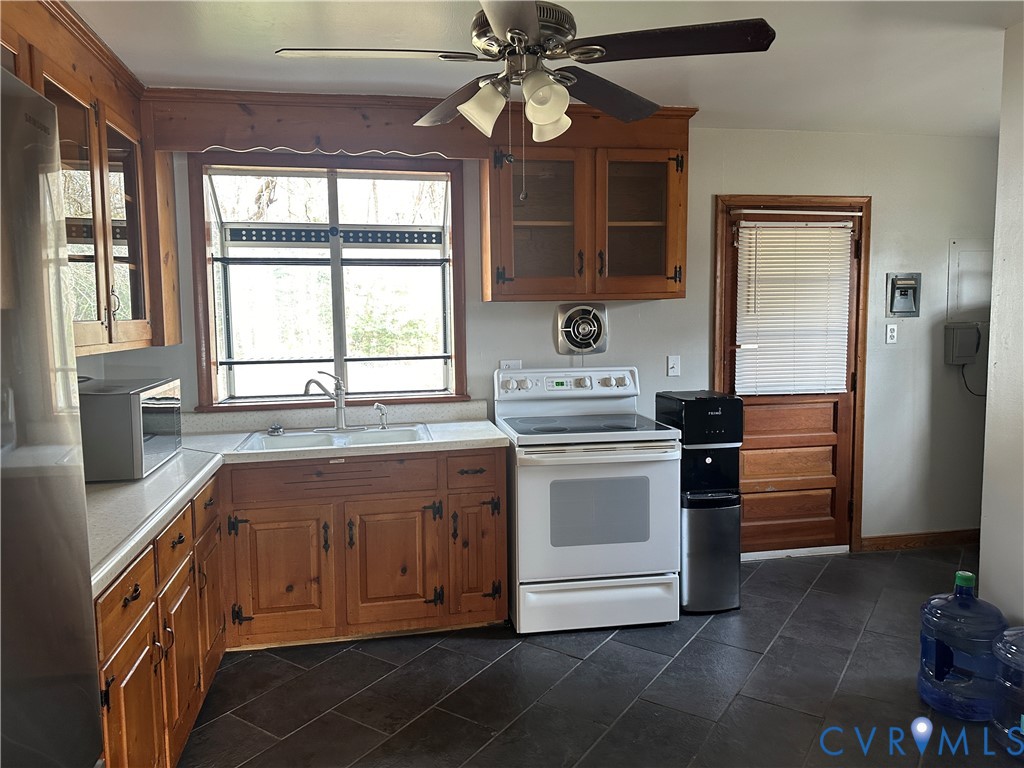 205 Airport Road Mattaponi, VA 23110 - Photo 5 of 15 Kitchen with glass fronted cabinets, wood finish c
