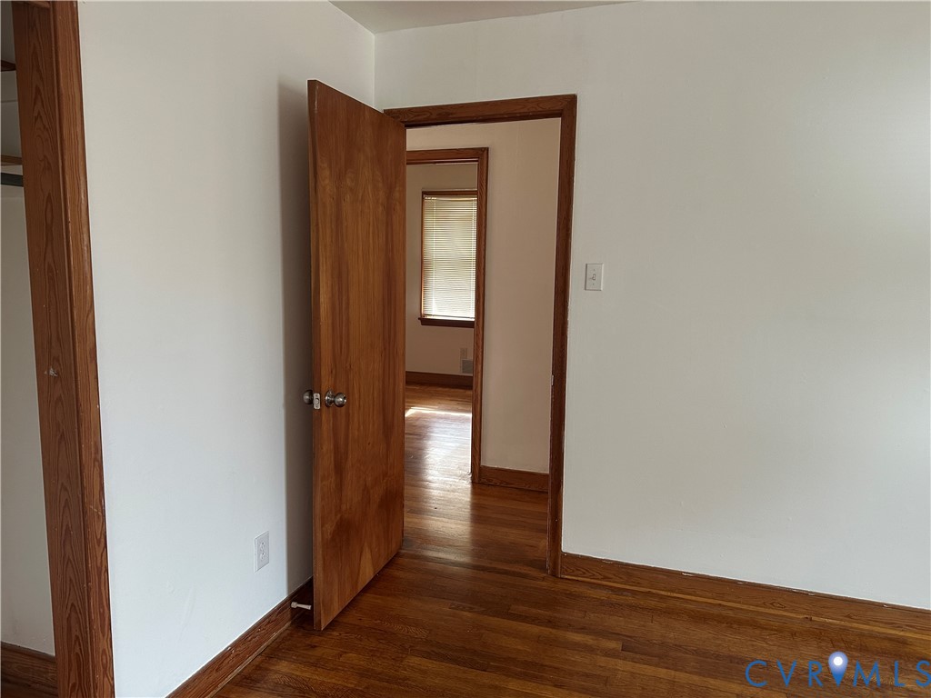 205 Airport Road Mattaponi, VA 23110 - Photo 9 of 15 Unfurnished room with baseboards and dark wood-typ