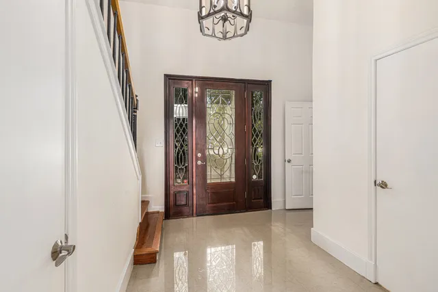 a view of an entryway with a hallway