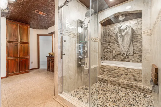 a view of walk in closet with wooden floor
