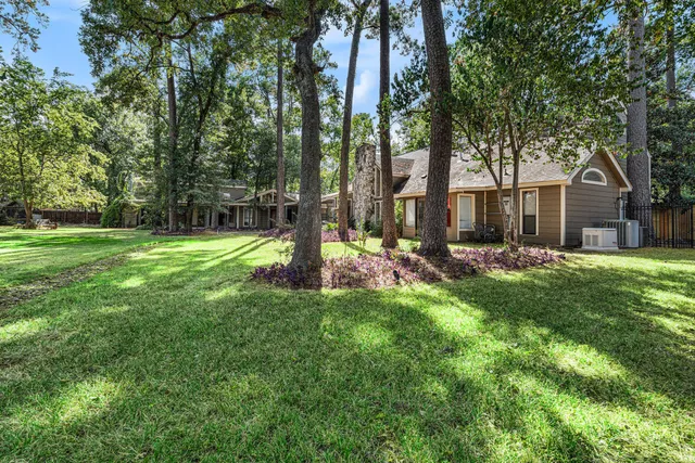 a backyard of a house with lots of green space