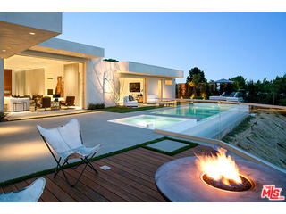 swimming pool view with a outdoor seating space