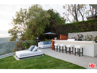 1645 Carla Ridge Beverly Hills, CA 90210 - Photo 12 of 26 a view of a house with backyard and sitting area