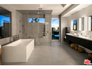 1645 Carla Ridge Beverly Hills, CA 90210 - Photo 16 of 26 a spacious bathroom with a tub a mirror and shower