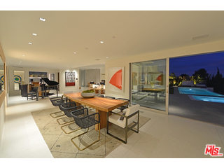 1645 Carla Ridge Beverly Hills, CA 90210 - Photo 8 of 26 a living room with furniture a rug and white walls