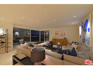 1645 Carla Ridge Beverly Hills, CA 90210 - Photo 9 of 26 a living room with furniture and a flat screen tv