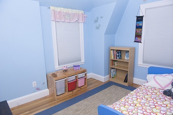 18 Jenness Street Quincy, MA 02169 - Photo 20 of 29 a room with furniture and wooden floor