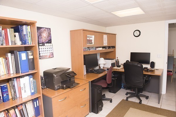 18 Jenness Street Quincy, MA 02169 - Photo 25 of 29 a view of a workspace with bookshelf