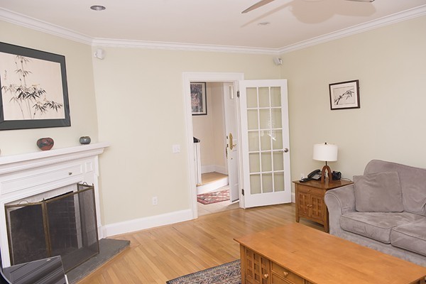18 Jenness Street Quincy, MA 02169 - Photo 9 of 29 a bedroom with furniture and a fireplace