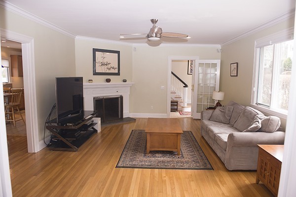 18 Jenness Street Quincy, MA 02169 - Photo 10 of 29 a living room with furniture and a fireplace
