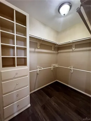 a view of an empty walk in closet
