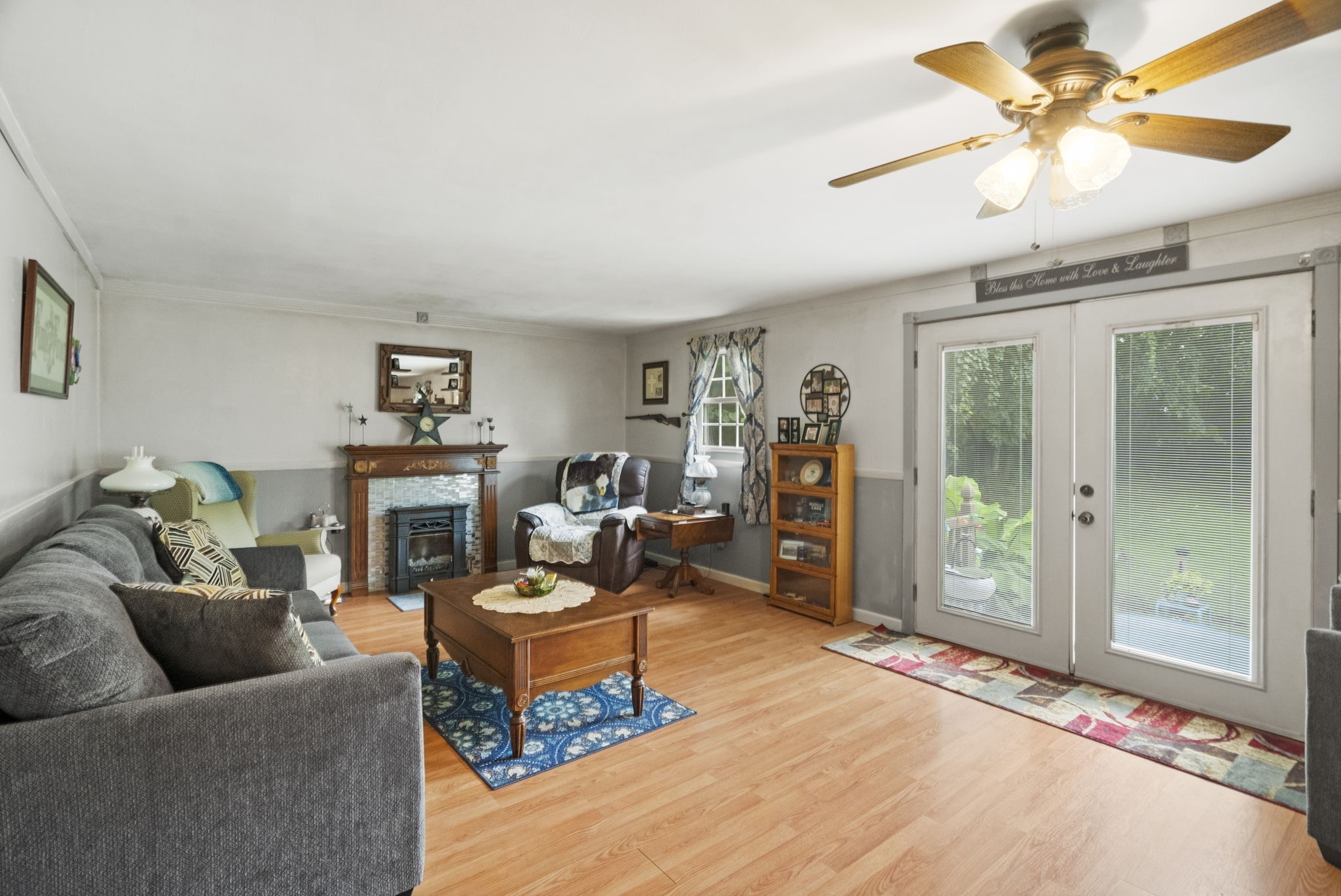 1680 New Deal Potts Road Portland, TN 37148 - Photo 10 of 37 a living room with furniture a fireplace and a chandelier
