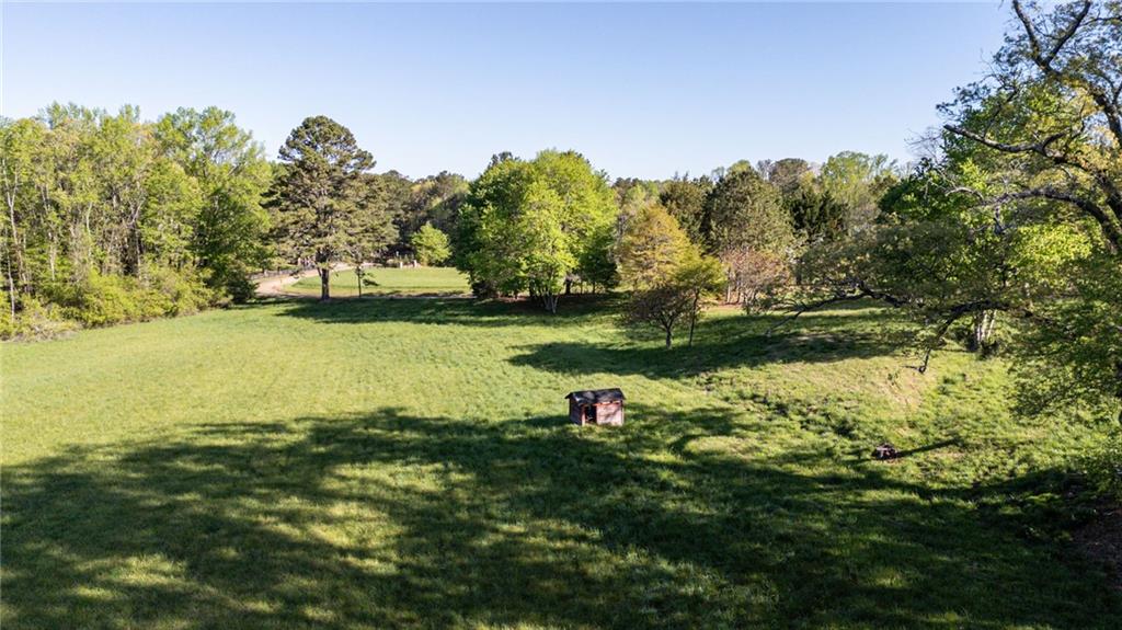 14260 Phillips Circle Milton, GA 30004 - Photo 14 of 16 a view of a lake with houses in the back
