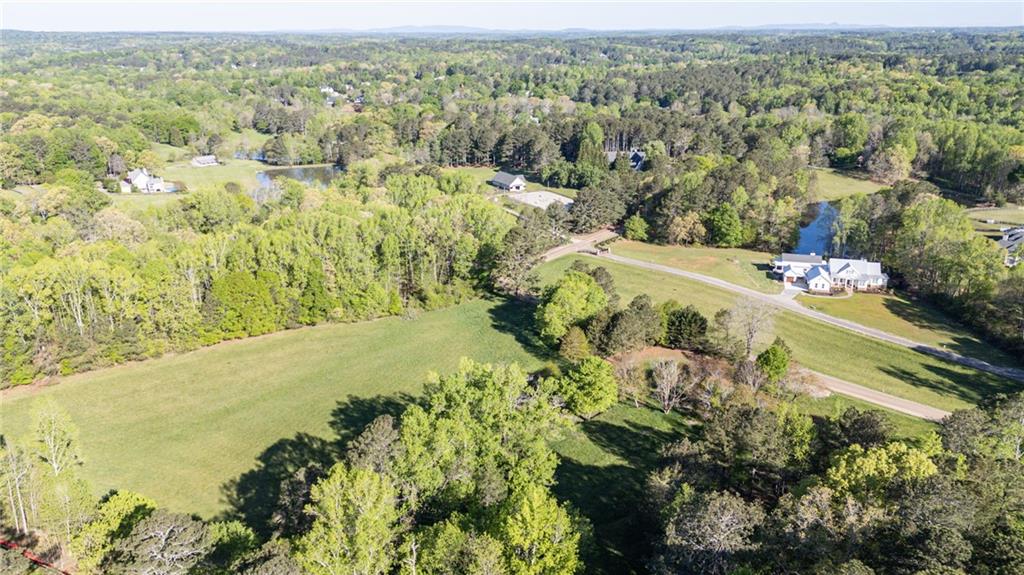 14260 Phillips Circle Milton, GA 30004 - Photo 3 of 16 a view of a lake with a mountain in the background