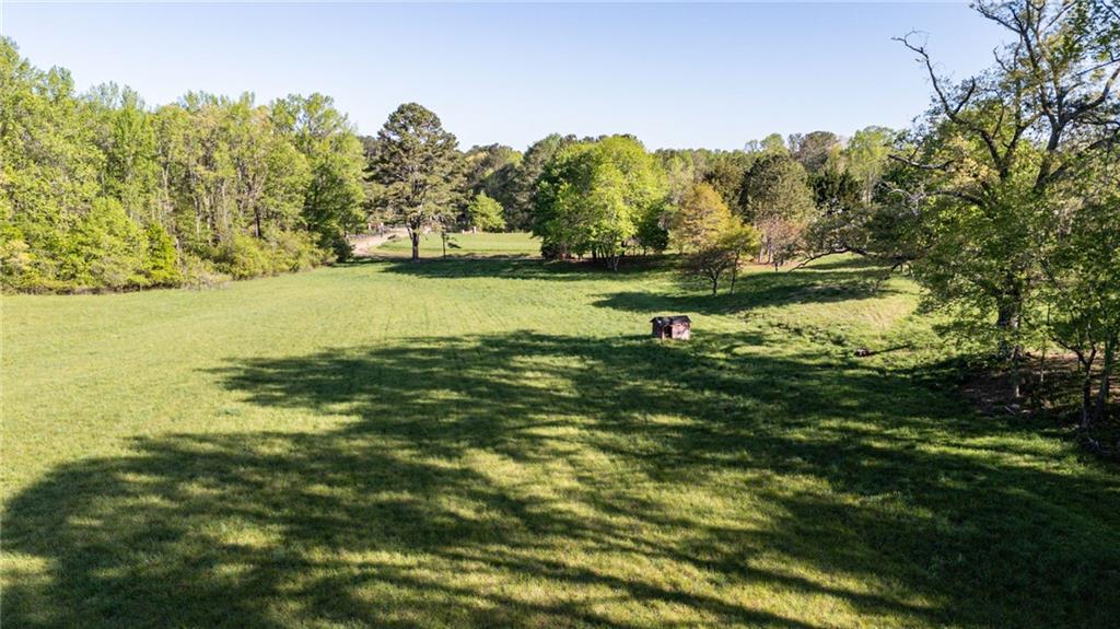 14260 Phillips Circle Milton, GA 30004 - Photo 7 of 16 a view of a lake with a mountain in the background