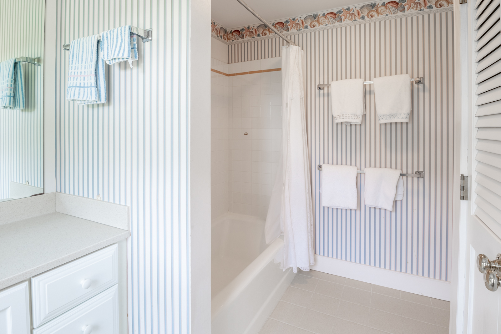 15 Swift Rock Road Nantucket, MA 02554 - Photo 26 of 32 a view of a bedroom with a white door