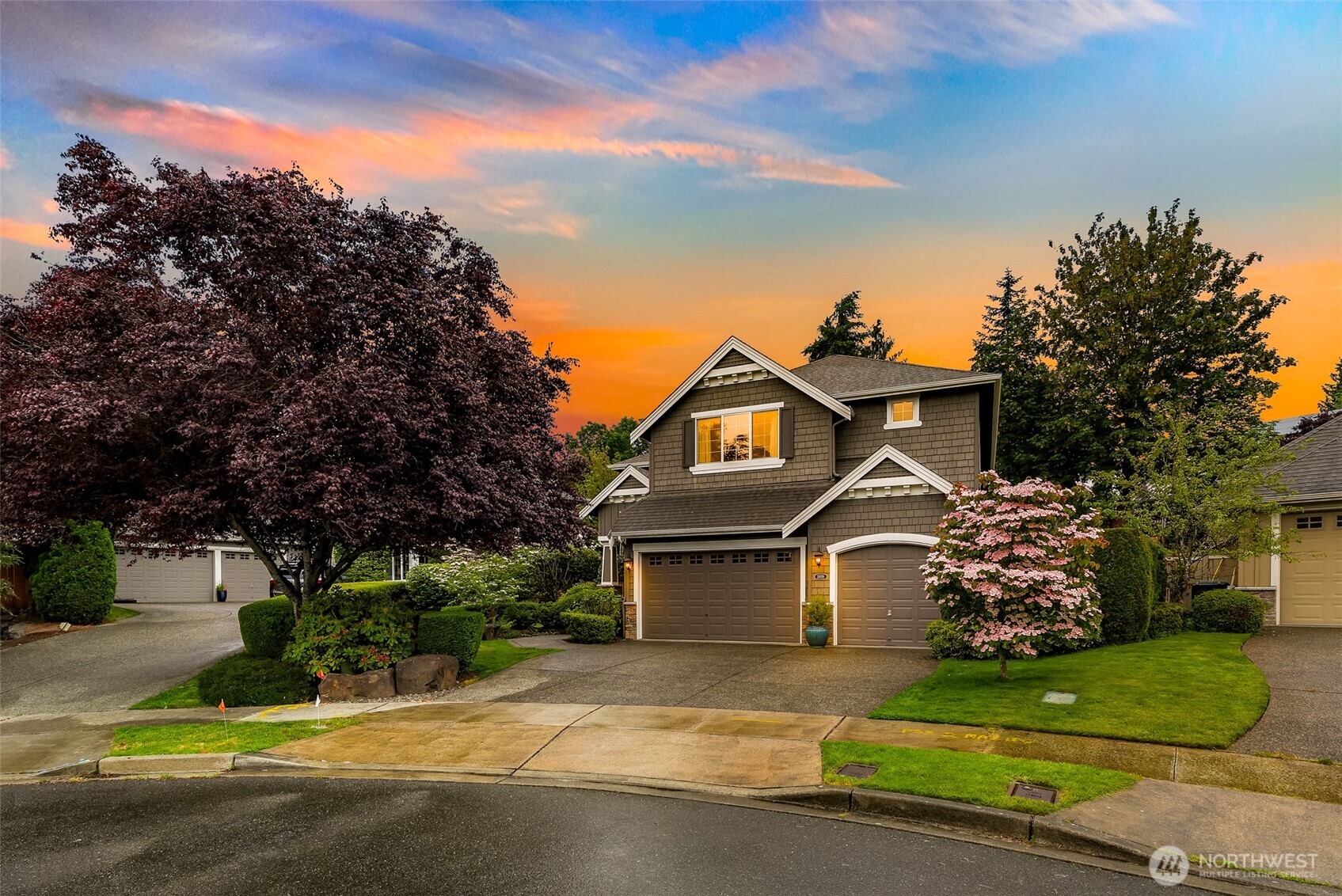 2029 240th Place Southeast Bothell, WA 98021 - Photo 4 of 39 a front view of a house with a garden
