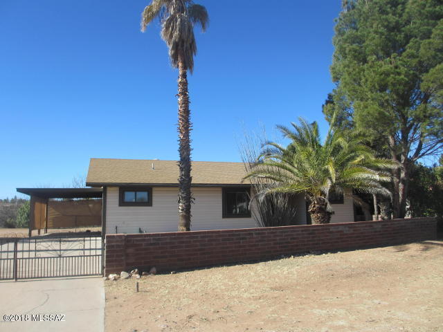 1160 Avenida Leon Rio Rico, AZ 85648 - Photo 3 of 47 a front view of a house with a yard