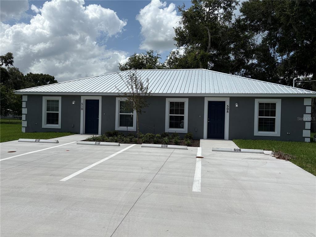 502 2nd Street Southwest Fort Meade, FL 33841 - Photo 2 of 39 front view of a house with a patio