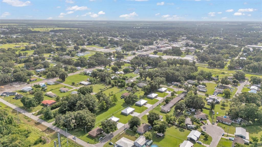 502 2nd Street Southwest Fort Meade, FL 33841 - Photo 36 of 39 an aerial view of residential houses with street and trees