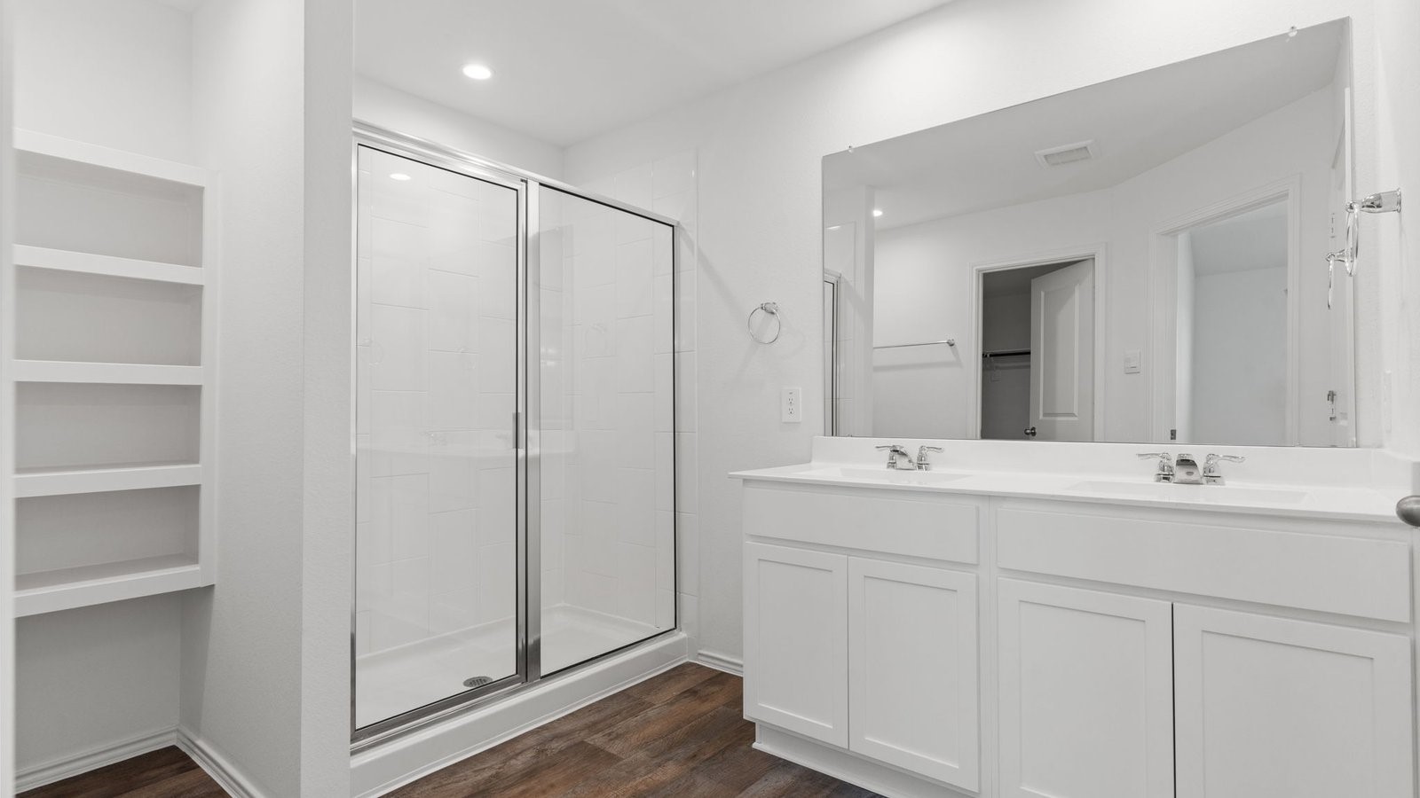 3623 Koop Loop Fulshear, TX 77423 - Photo 20 of 47 a bathroom with a double vanity sink and mirror