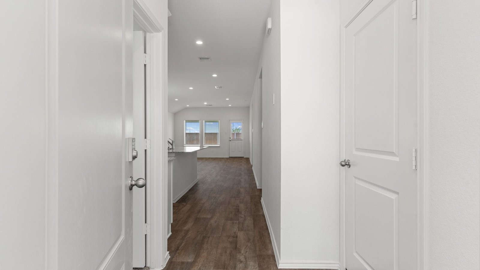 3623 Koop Loop Fulshear, TX 77423 - Photo 2 of 47 a view of a hallway with a wooden floor