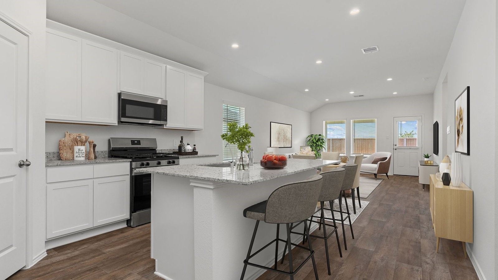 3623 Koop Loop Fulshear, TX 77423 - Photo 4 of 47 a view of kitchen with microwave stove top oven and cabinets