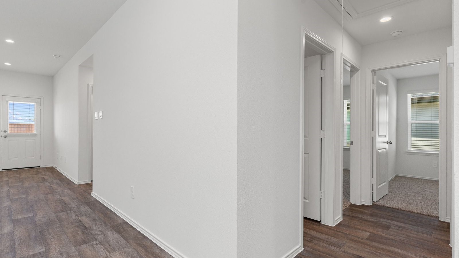3623 Koop Loop Fulshear, TX 77423 - Photo 5 of 47 a view of hallway with wooden floor