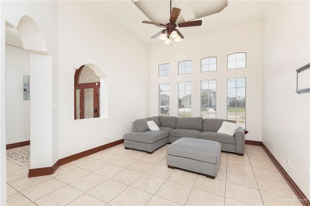 1213 Rhett Drive Pharr, TX 78577 - Photo 4 of 19 Inviting living room with soaring ceilings, abundant natural light, and open layout.