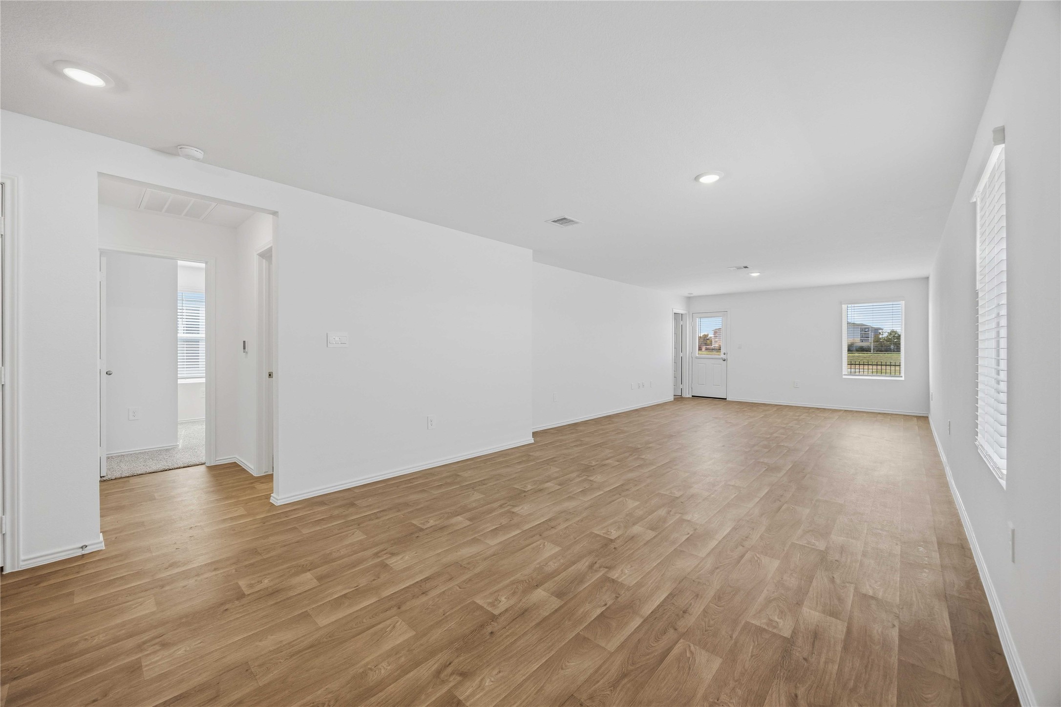 11913 Sweet Apple Lane Houston, TX 77048 - Photo 8 of 20 a view of empty room with wooden floor and window