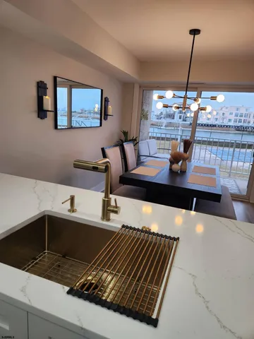 a living room with table chairs and a couch