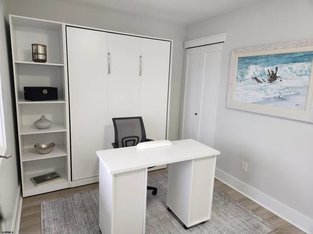 a room with a table and workspace