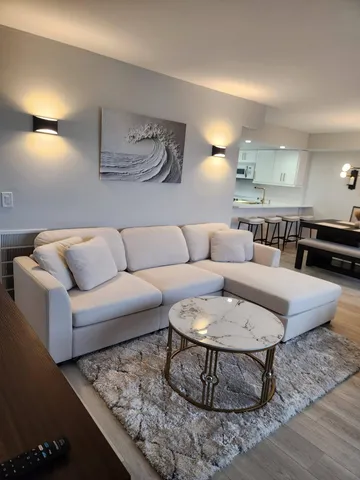 a living room with furniture and a couch