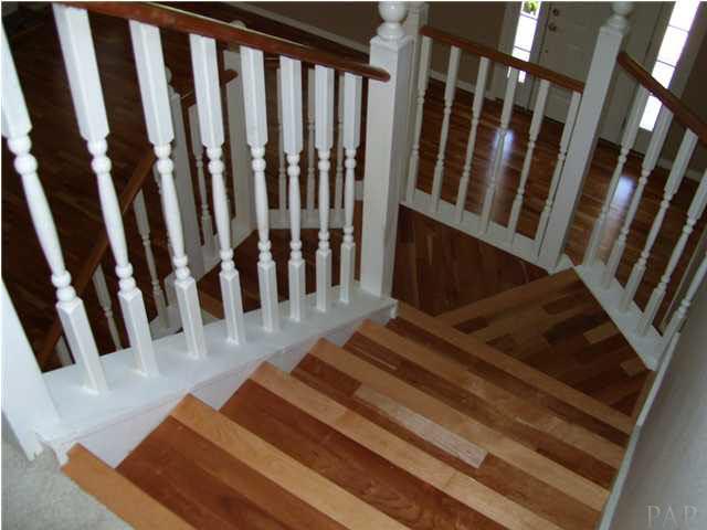 SPIRAL STAIRCASE LEADS TO MASTER BEDROOM LOFT LIBRARY