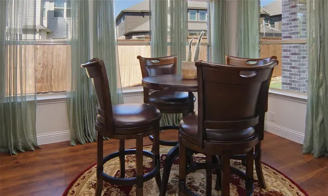 a view of a room with furniture and windows