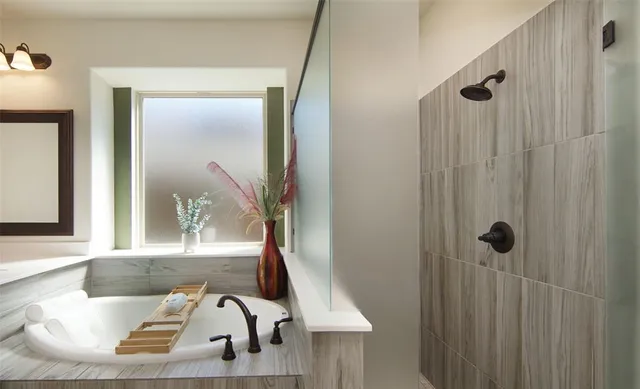 a bathroom with a sink and mirror with bathtub