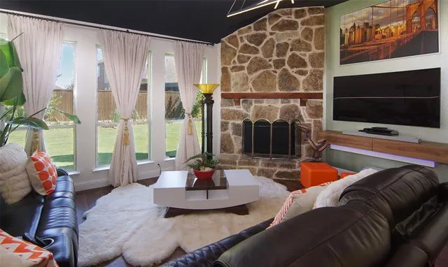 a living room with furniture and a flat screen tv