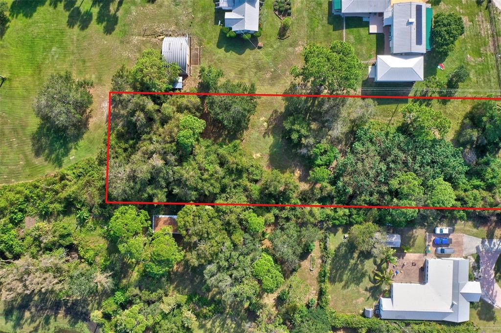 0 South Tropical Trail Merritt Island, FL 32952 - Photo 19 of 46 an aerial view of residential house with outdoor space and trees all around