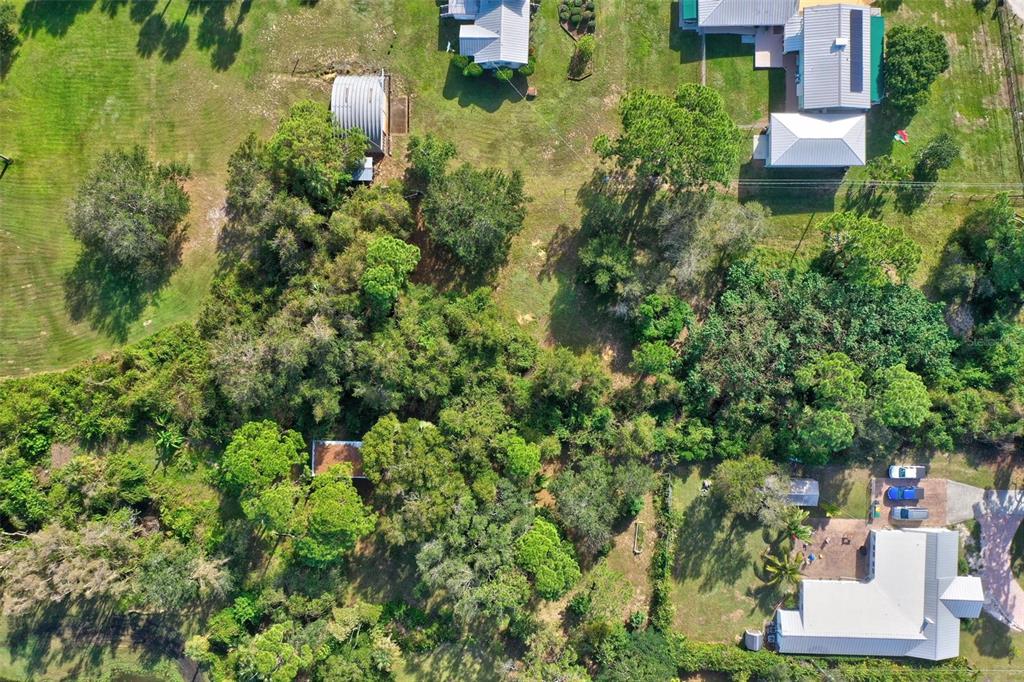 0 South Tropical Trail Merritt Island, FL 32952 - Photo 20 of 46 an aerial view of residential house with outdoor space and trees all around