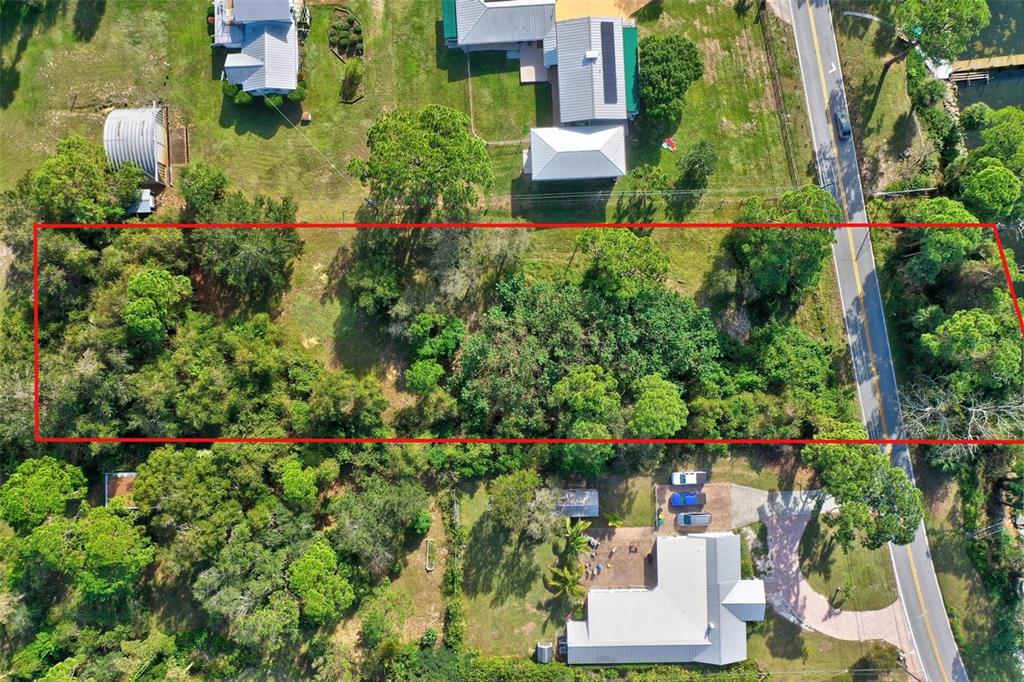 0 South Tropical Trail Merritt Island, FL 32952 - Photo 21 of 46 an aerial view of a house with a yard and garden