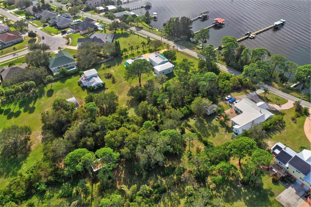 0 South Tropical Trail Merritt Island, FL 32952 - Photo 26 of 46 an aerial view of residential houses with outdoor space and trees