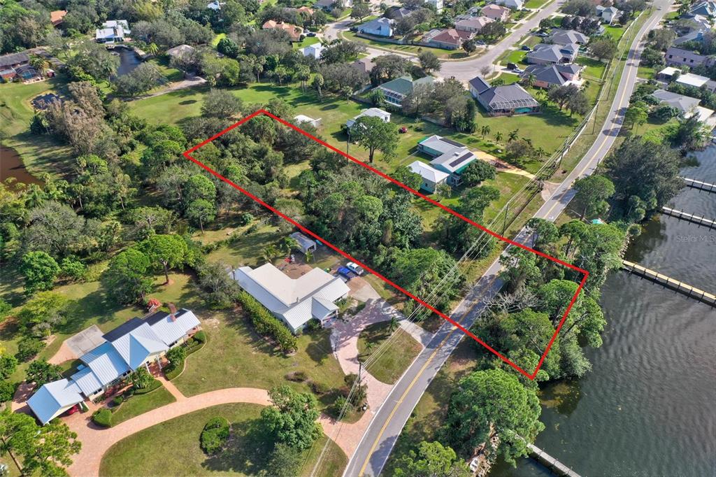 0 South Tropical Trail Merritt Island, FL 32952 - Photo 31 of 46 an aerial view of residential houses with outdoor space and trees
