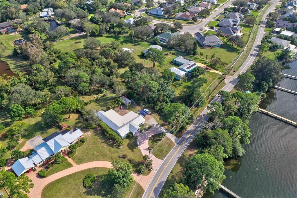 0 South Tropical Trail Merritt Island, FL 32952 - Photo 32 of 46 an aerial view of residential houses with outdoor space