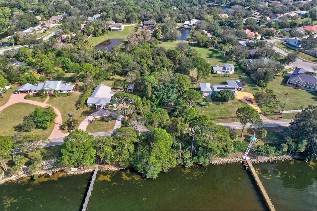 0 South Tropical Trail Merritt Island, FL 32952 - Photo 36 of 46 an aerial view of residential houses with outdoor space and trees