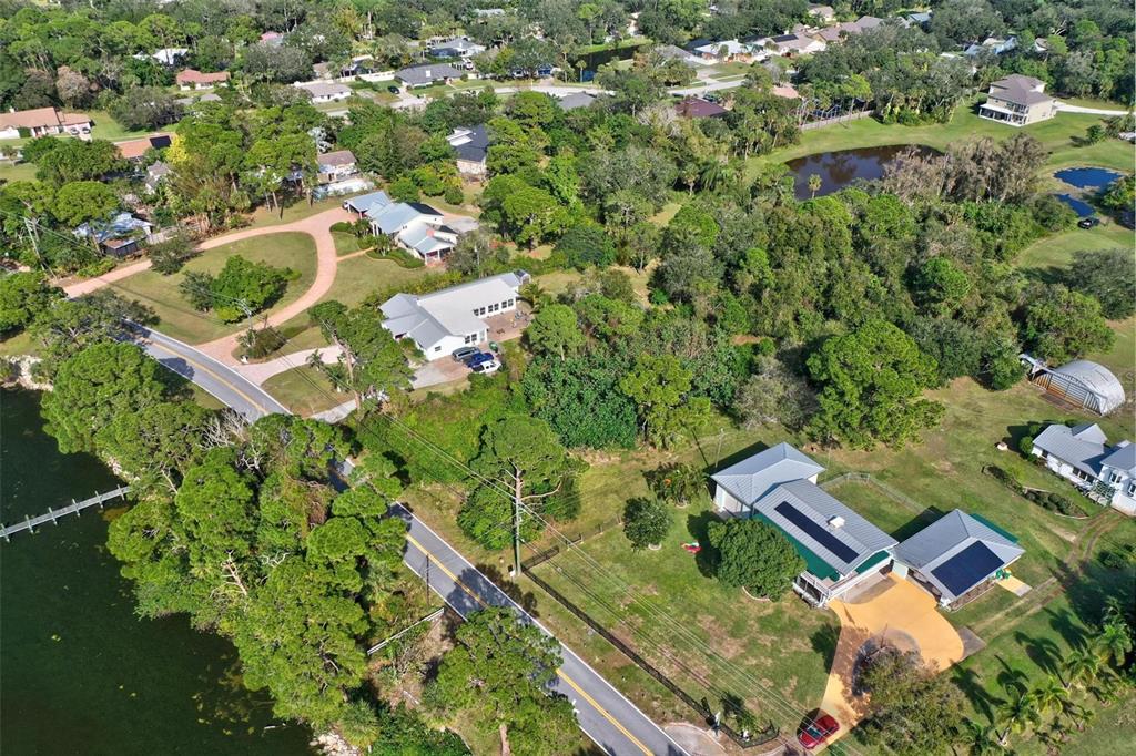 0 South Tropical Trail Merritt Island, FL 32952 - Photo 38 of 46 an aerial view of residential house with outdoor space and trees all around