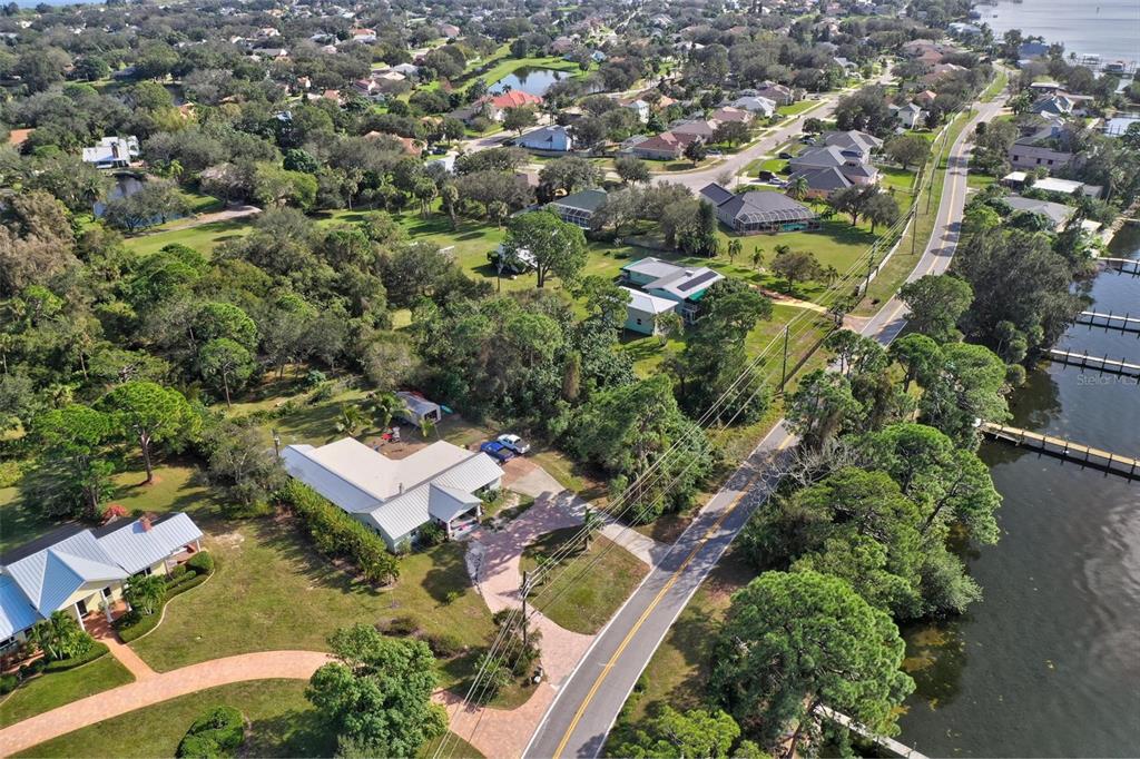 0 South Tropical Trail Merritt Island, FL 32952 - Photo 4 of 46 an aerial view of residential house with outdoor space and trees all around