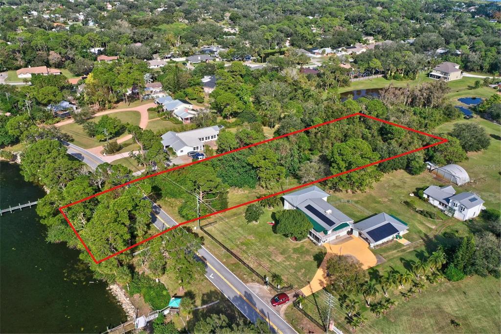 0 South Tropical Trail Merritt Island, FL 32952 - Photo 41 of 46 an aerial view of residential houses with outdoor space and trees